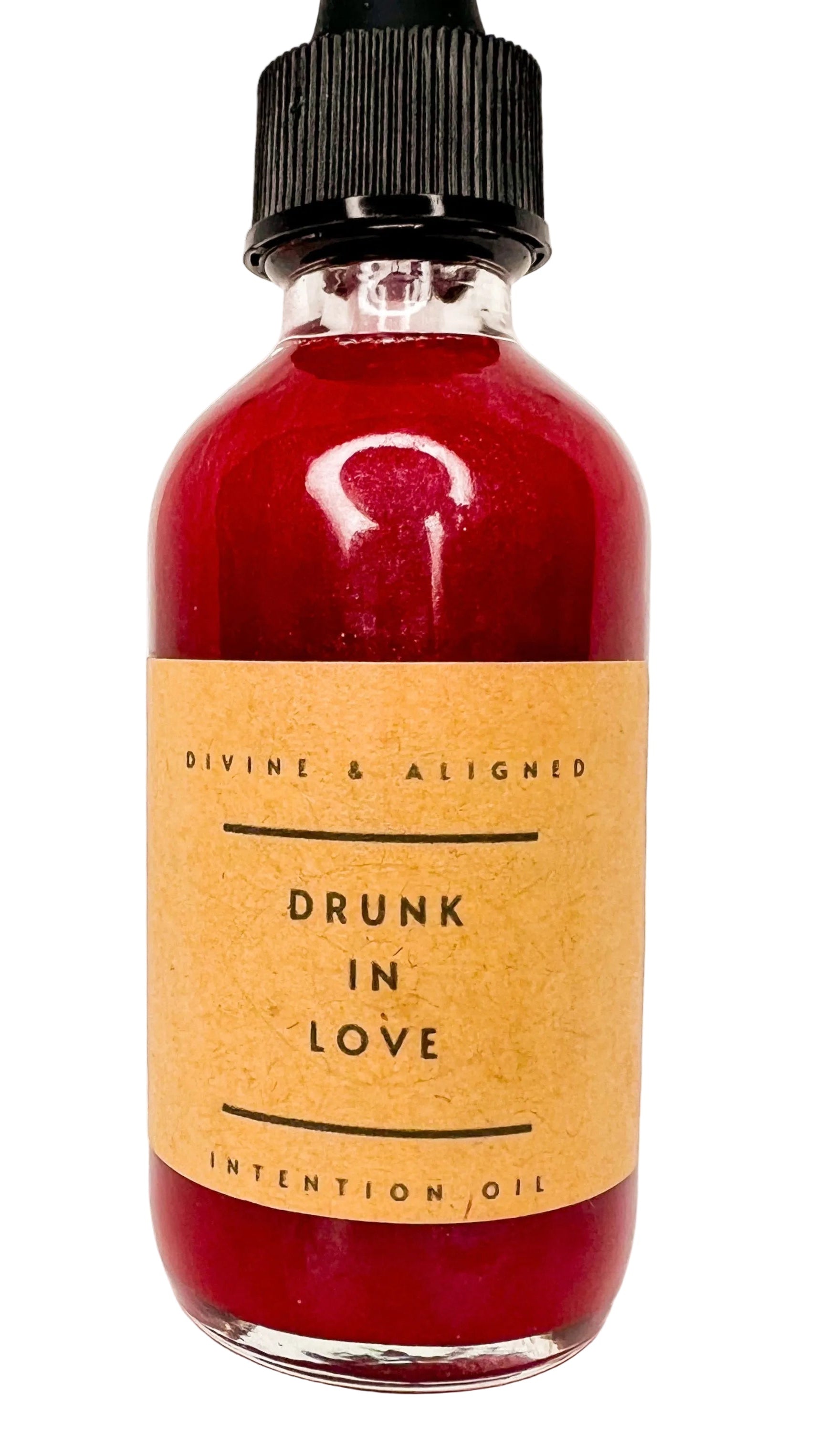 Bottle of 'Drunk in Love' intention oil with a brown label on a white background